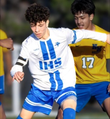 Soccer players competing in Lexa uniforms